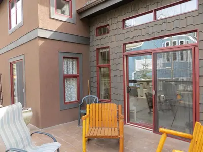 a patio with two chairs and a table at Buffaloberry Bed & Breakfast in Banff