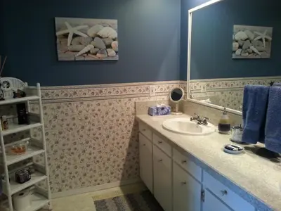 a bathroom with a sink and a mirror at Hammond Bay Oceanside Guesthouse in Nanaimo