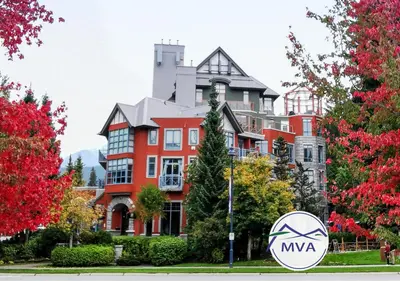 a large red building with aania sign in front of it at Alpenglow Lodge by MVA in Whistler