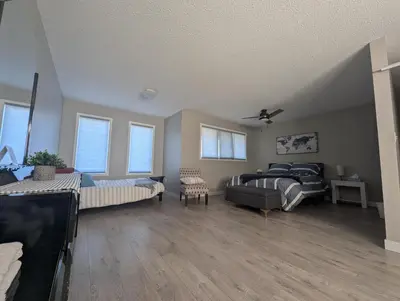 a large living room with two beds and a couch at The Ranch Highway 55 in Debden