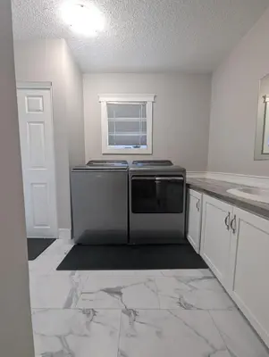a kitchen with a sink and a microwave at The Ranch Highway 55 in Debden