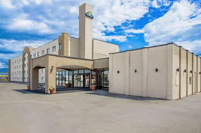 a building with a clock tower on top of it at Days Inn by Wyndham Cranbrook Conference Centre in Cranbrook