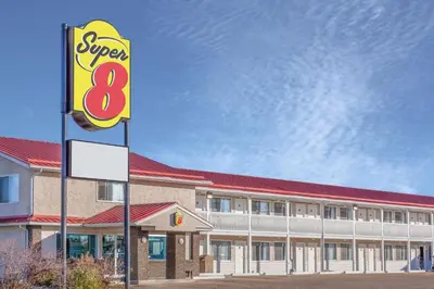 a sign in front of a fast food restaurant at Super 8 by Wyndham Stettler in Stettler