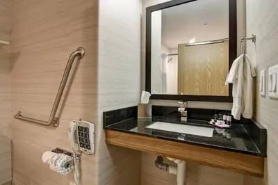 a bathroom with a sink and a mirror at Canalta St.Paul in St. Paul