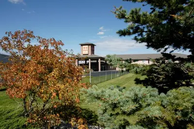 a building with a sign on the side of it at R&R Inn & Suites in Camrose