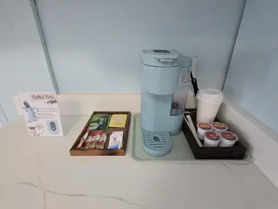 a coffee maker sitting on top of a refrigerator at Richca Chalets Resort in Hope