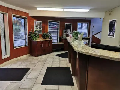 an office with a lobby with a counter with plants at Hope Inn and Suites in Hope