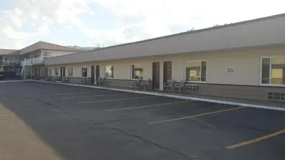 an empty parking lot in front of a building at Shoreline Resort Condominiums in Penticton