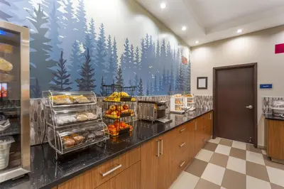 a kitchen with a display of food on a counter at Best Western Plus Hinton Inn & Suites in Hinton