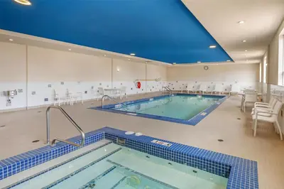 a swimming pool in a building with a large pool at Best Western Plus Hinton Inn & Suites in Hinton