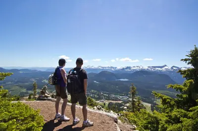 two men standing on top of a mountain looking at the valley at Old House Hotel in Courtenay