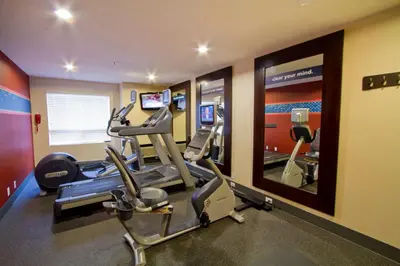 a gym with cardio equipment in a hotel room at Hampton Inn - Vancouver Airport/Richmond in Richmond