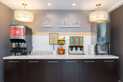a coffee shop with two lights on a counter at Hampton Inn & Suites, by Hilton - Vancouver Downtown in Vancouver
