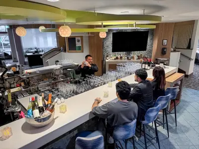 a group of people sitting at a bar at Coast Bastion Hotel in Nanaimo