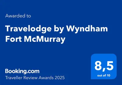 a blue sign with the words travelodge by wyrham font memory at Travelodge by Wyndham Fort McMurray in Fort McMurray