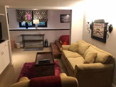 a living room with a couch and a table at Barclay House Bed and Breakfast in Vancouver