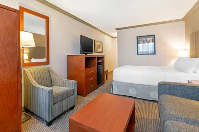 a hotel room with a bed and a tv at Best Western Plus Barclay Hotel in Port Alberni