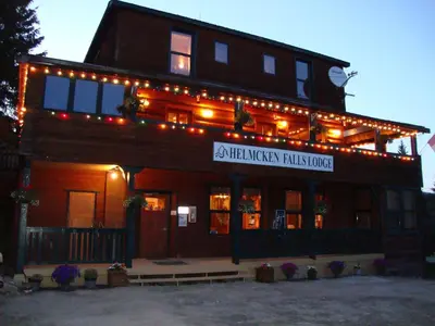 a building with lights on top of it at Helmcken Falls Lodge Cabin Rooms and RV Park in Clearwater