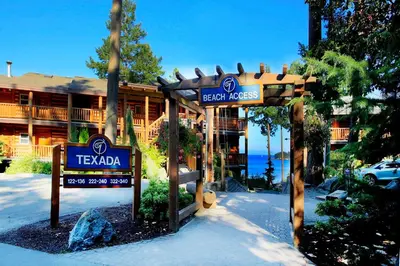 a sign for a hotel in front of a building at Tigh-Na-Mara Seaside Spa Resort in Parksville