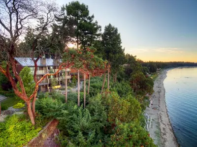 a house on the shore of a body of water at Tigh-Na-Mara Seaside Spa Resort in Parksville