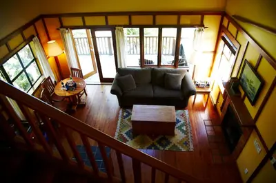 a living room with a couch and a table at Middle Beach Lodge in Tofino