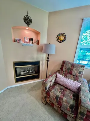 a living room with a couch and a fireplace at Seafarer Bed & Breakfast in Tofino
