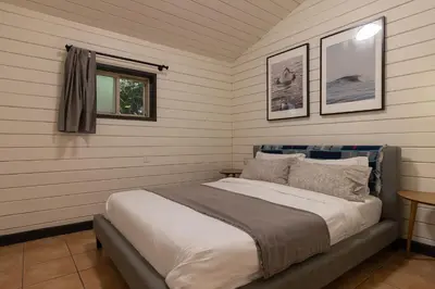 a bedroom with a bed in a room at Mackenzie Beach Resort in Tofino