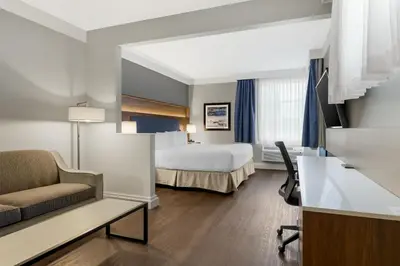 a hotel room with a bed and a couch at Best Western Plus Revelstoke in Revelstoke