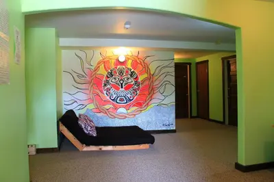 a room with a painting on the wall at Dreamcatcher Hostel in Golden