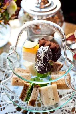 a plate of desserts on a glass plate at The Inn at the Union Club of British Columbia in Victoria