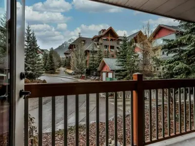 a view of a street from a balcony at Suites with Pool & Hot tubs managed by Little Sister Getaways in Canmore