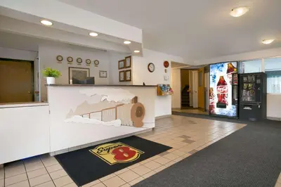 a lobby with a counter with a toy car on it at Super 8 by Wyndham Revelstoke BC in Revelstoke