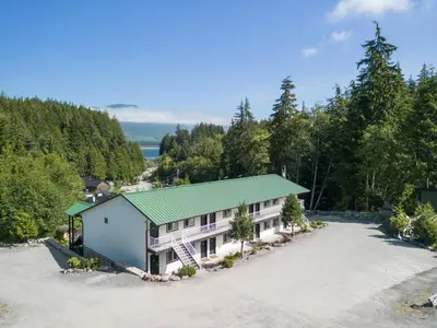 an aerial view of a house with a green roof at West Coast Trail Lodge in Port Renfrew