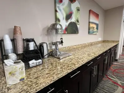 a kitchen counter with a blender on top of it at Chateau Inn & Suites Bonnyville in Bonnyville