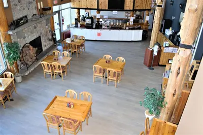 an overhead view of a restaurant with wooden tables and chairs at Fernie Stanford Resort in Fernie