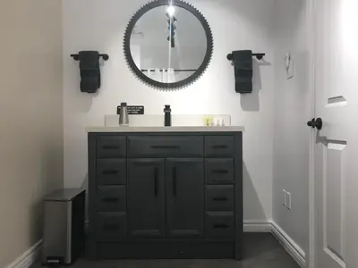 a bathroom with a sink and a mirror on the wall at Canadian Rockies Inn - Adults only in Field