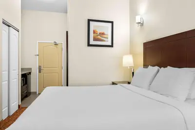 a large white bed in a hotel room at Best Western Williams Lake in Williams Lake