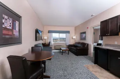 a living room with a couch and a table at Prestige Cranbrook Hotel, BW Premier Collection in Cranbrook