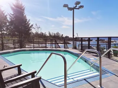 a swimming pool with a light blue water at Black Rock Oceanfront Resort in Ucluelet