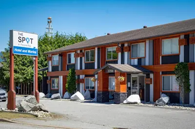 a hotel sign in front of a building at The Spot at Porpoise Bay in Sechelt