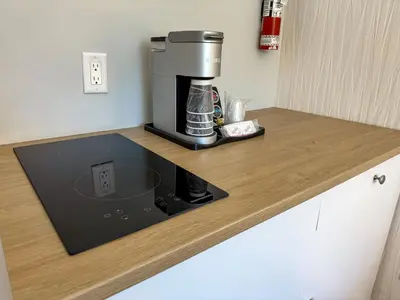 a coffee maker on a counter in a kitchen at The Spot at Porpoise Bay in Sechelt