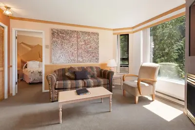 a living room with a couch and a table at The Marquise by Whistler Premier in Whistler