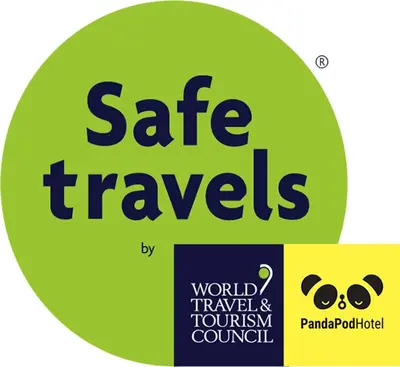 a green circle with the words safe travels on it at Panda Pod Hotel in Richmond