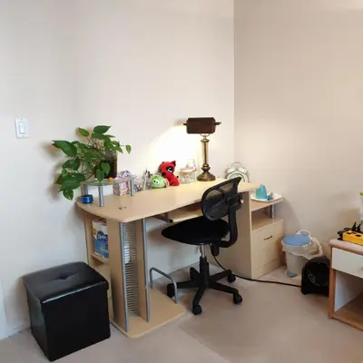 an office with a desk with a chair and a lamp at Helen's House / Close to Skytrain and Airport in Vancouver