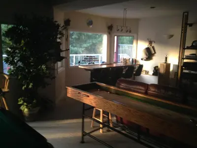 a bar in a room with a couch and a table at Eagle's Nest B&B in Lake Country