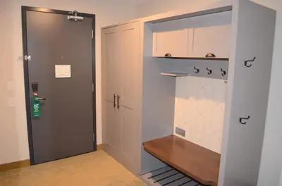 a walk in closet with a door and a shelf at Holiday Inn Edmonton South - Evario Events by IHG in Edmonton