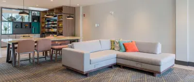 a living room with a couch and a table at Holiday Inn Edmonton South - Evario Events by IHG in Edmonton