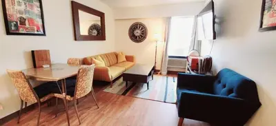 a living room with a table and a couch at Western Lodge in Kimberley