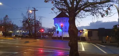 a lit up tower on a street with a red light at Painted Turtle Guesthouse in Nanaimo