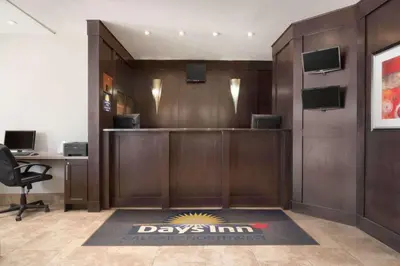 an office lobby with a desk and a desk at Days Inn by Wyndham Calgary Northwest in Calgary